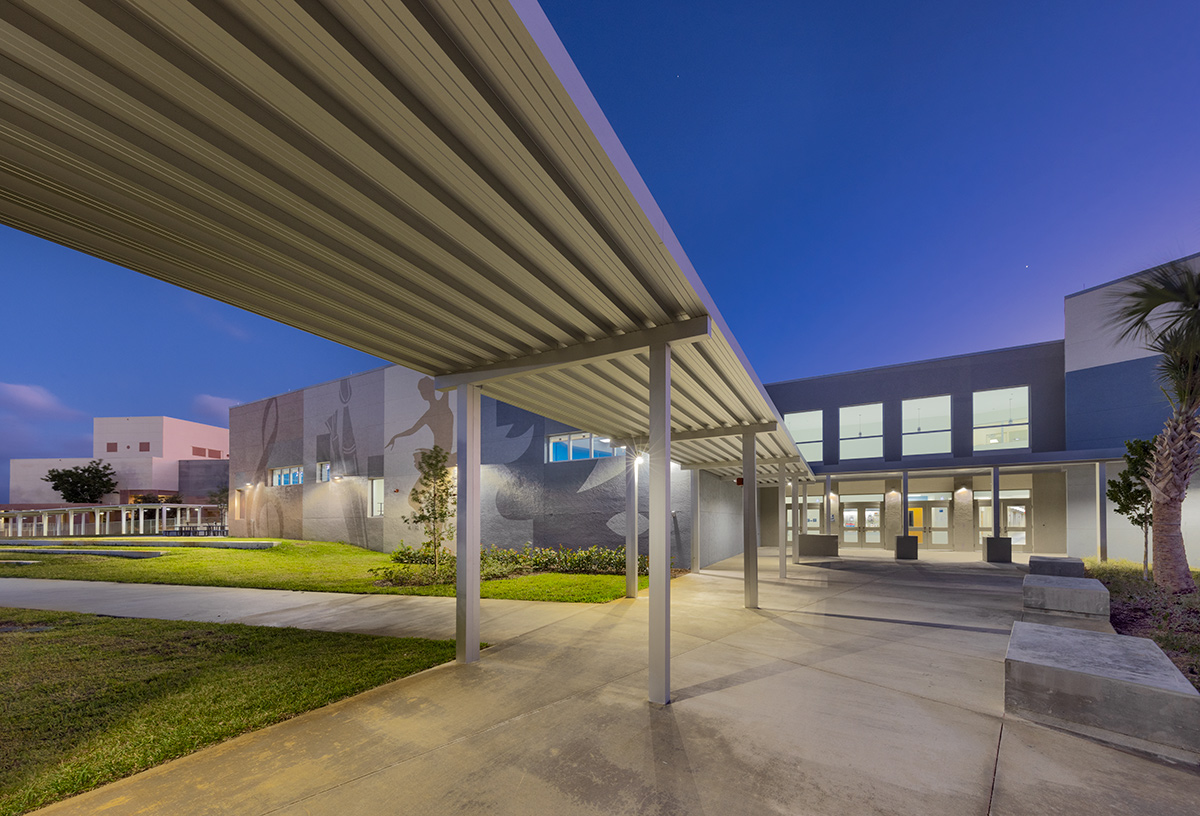 Architectural dusk view of the Plumosa School of the Arts in Delray Beach. FL.